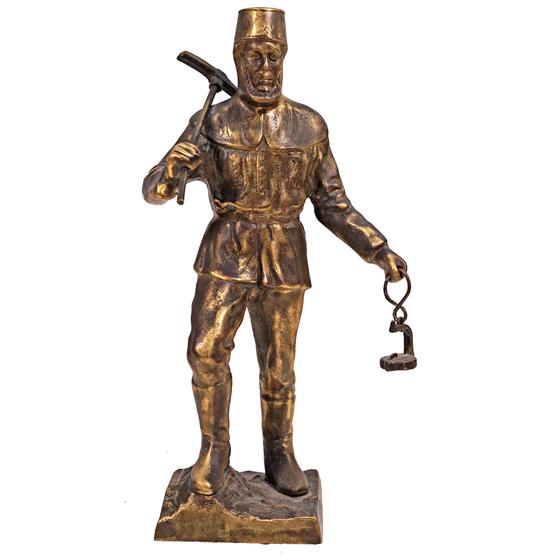 Bronzová socha horníka